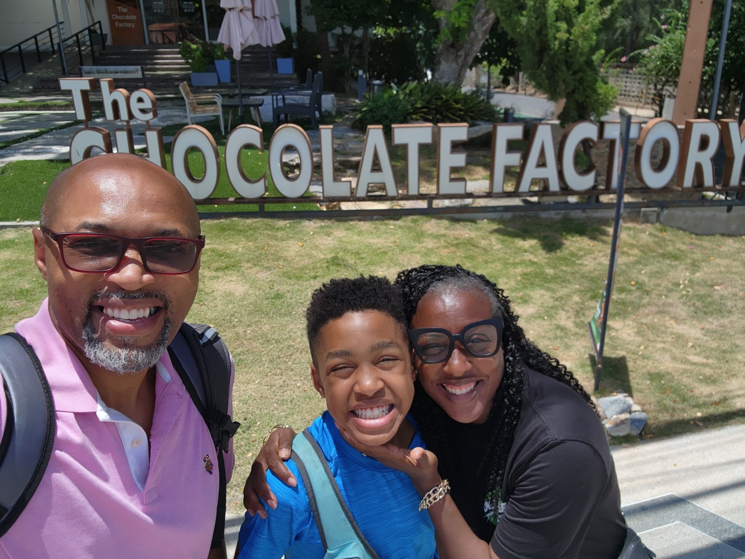The family smiling during a visit to the Chocolate Factory
