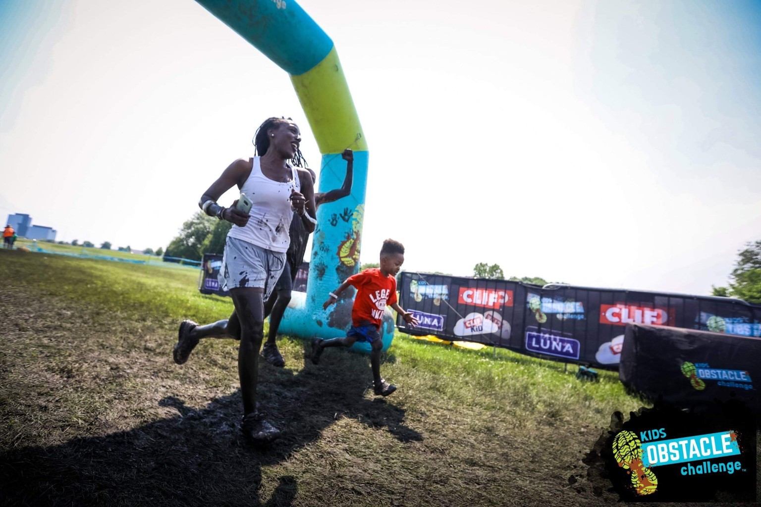 Tiffany and Myles running an obstacle course