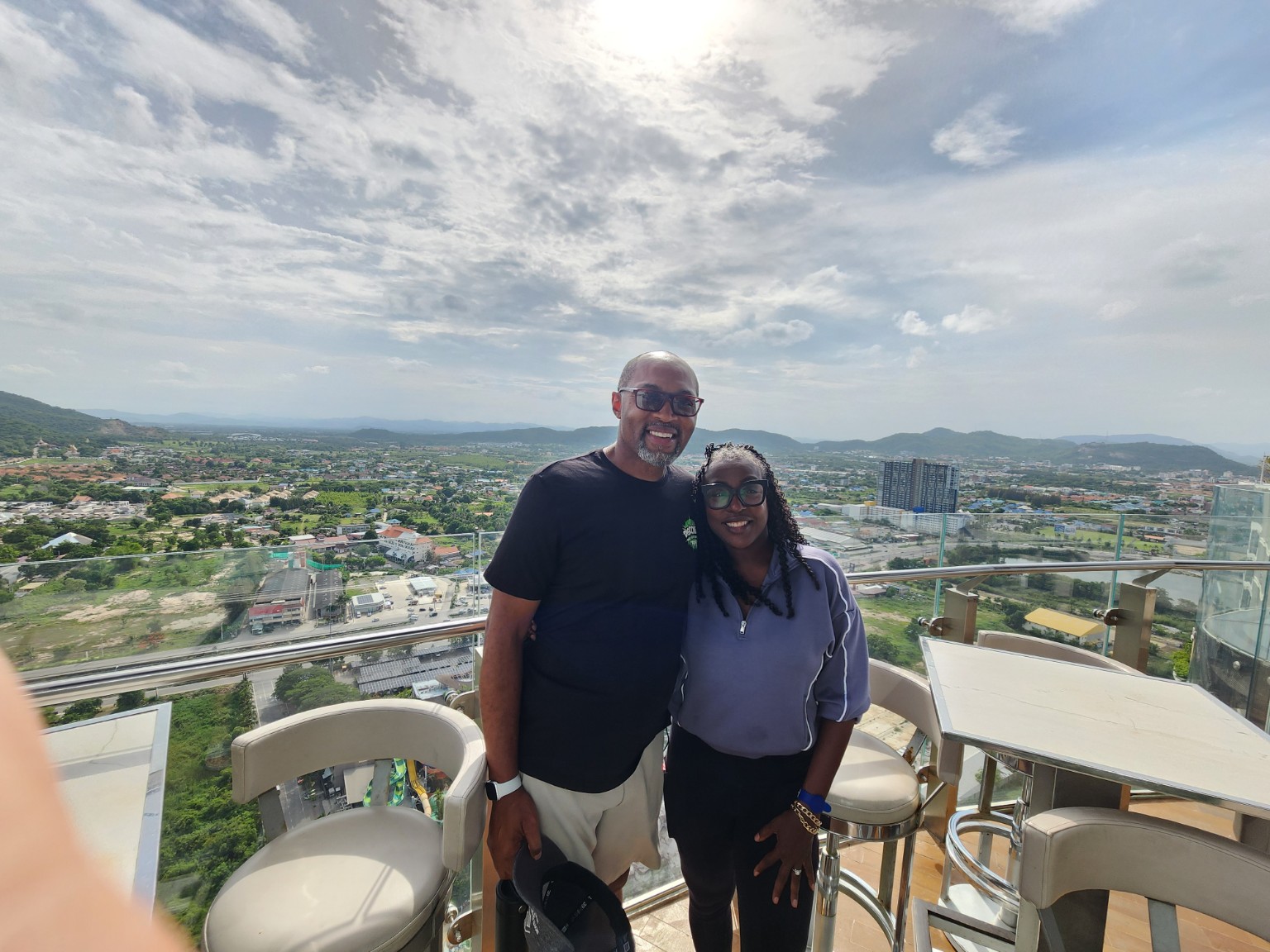 Wendell and Tiffany smiling together above the city
